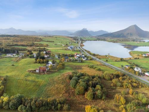 an aerial view of a town and a lake at 2 Houses & A Barn Twin Room in Leknes