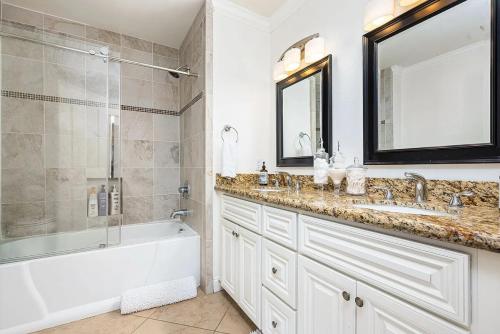 a bathroom with a tub and a sink and a shower at Villa LaQuinta Free Pool Heating RV Parking at Point Happy in La Quinta