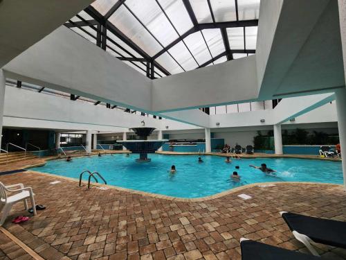 a group of people swimming in a swimming pool at Landmark 1134 in Myrtle Beach