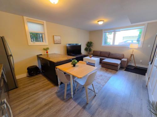 a living room with a table and a couch at Sandy Hill Downtown Guesthouse in Ottawa