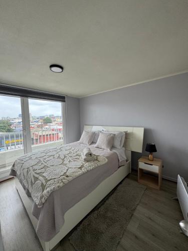 Postel nebo postele na pokoji v ubytování Departamento concepción con parking