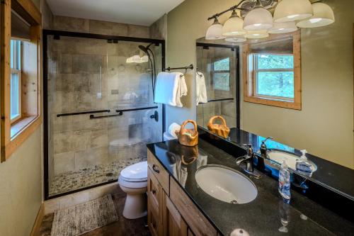 a bathroom with a shower and a sink and a toilet at Relaxing Mountain View Cabin near Banner Elk, NC in Banner Elk