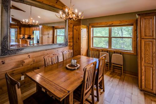 a dining room with a wooden table and chairs at Relaxing Mountain View Cabin near Banner Elk, NC in Banner Elk