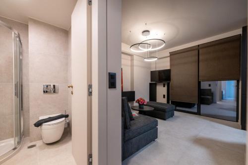 a living room with a couch and a table at Elaura Luxury Residences in Kalamata