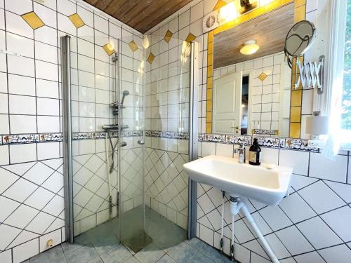 a bathroom with a shower and a sink at 4 person holiday home in UDDEVALLA in Uddevalla