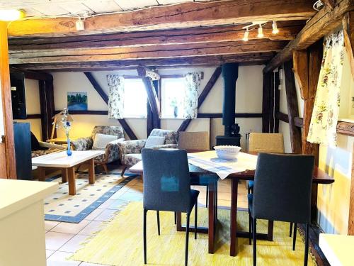a living room with a table and chairs at 4 person holiday home in UDDEVALLA in Uddevalla