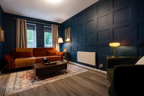 a living room with a couch and a table at Finnieston 1BR - Walk to Hydro & SEC - Parking in Glasgow