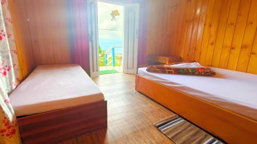 Ένα ή περισσότερα κρεβάτια σε δωμάτιο στο Gyabak homestay, Kaffergaon, Kalimpong