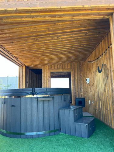a wooden building with a bar in the middle at Makihyte dom na wyłączność z panoramą na morze i strefą SPA in Sasino