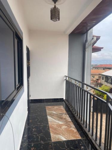 a corridor of a house with a balcony at Chic Appartement Meuble Wi-Fi gratuit in Yaoundé