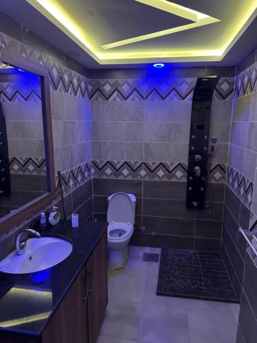a bathroom with a toilet and a sink at Sallam Lux Property in Hurghada
