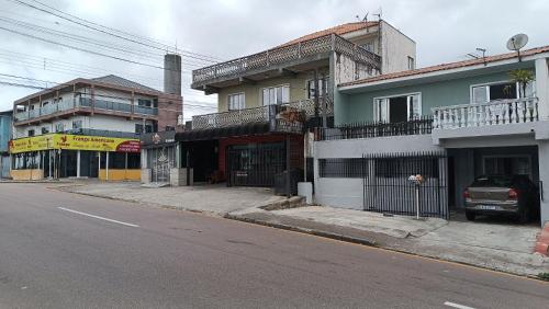 an empty street in a city with a building at Sobrado in Curitiba