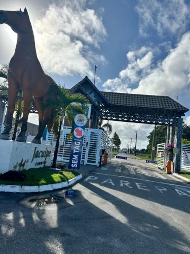 a statue of a horse on the side of a road at Village em Barra do Jacuípe in Camaçari