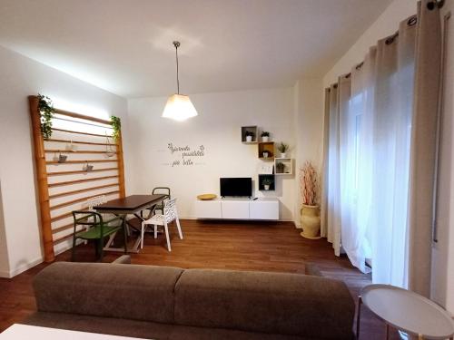 a living room with a couch and a table at Casa Maricciotti in Terni