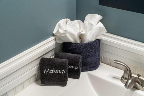 a bathroom sink with two baskets on top of it at Hideaway Hot Tub Sunna Lake Kayaks Pool in Bushkill