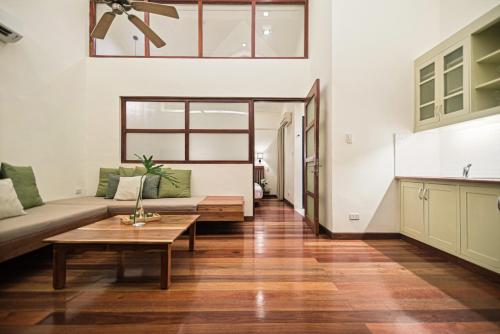 a living room with a couch and a table at The Strand Boutique Resort in Boracay