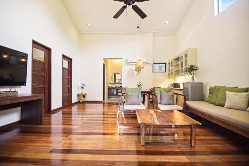 a living room with a couch and a table at The Strand Boutique Resort in Boracay
