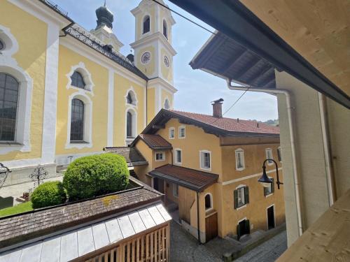 a view from a window of a church with a clock tower at Hopfgarten Alpin Living Top 6 in Hopfgarten im Brixental