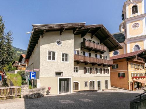 a large building with a clock on the side of it at Hopfgarten Alpin Living Top 6 in Hopfgarten im Brixental