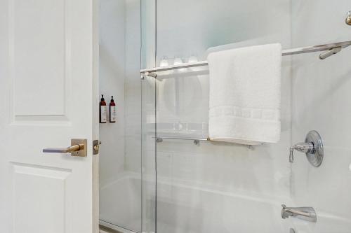 a bathroom with a shower with a glass door at Beaver Creek West 22 in Avon