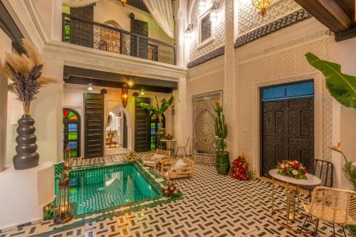 a house with a swimming pool in a room at Dar Bonita in Marrakech