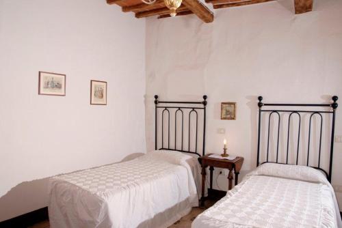 Ένα ή περισσότερα κρεβάτια σε δωμάτιο στο Residenza d'Epoca Il Cassero