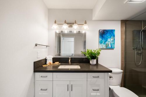 a bathroom with a sink and a mirror at Lahaina Shores 523 · LS 523 Direct Beachfront Studio with Stunni in Lahaina