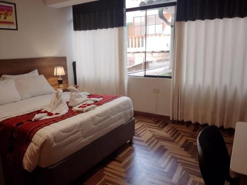 Cama o camas de una habitación en Hostel Tupac Yupanqui House