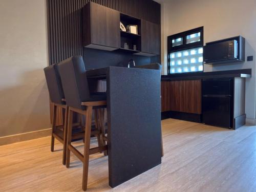Dapur atau dapur kecil di Hotel Montessuites