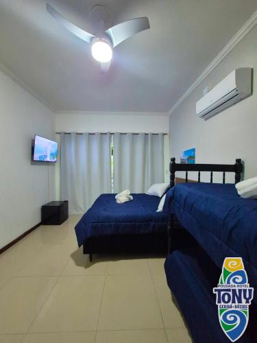 Ένα ή περισσότερα κρεβάτια σε δωμάτιο στο Tony Pousada Hotel Geribá