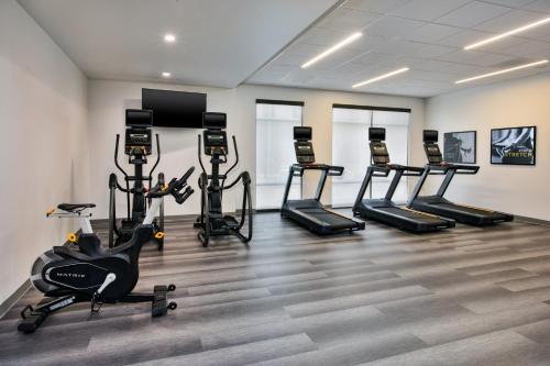 a gym with treadmills and exercise bikes in a room at Staybridge Suites Grand Rapids South by IHG in Grand Rapids
