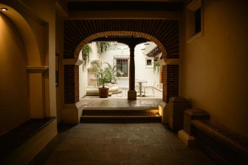 an entrance to a building with an archway at Casa del Sol Antigua in Antigua Guatemala