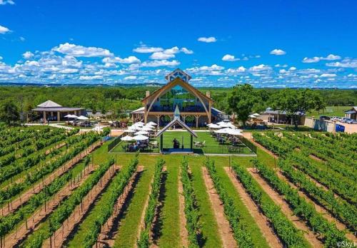 an aerial view of a farm with a large building at Andromeda at The Retreat in Fredericksburg