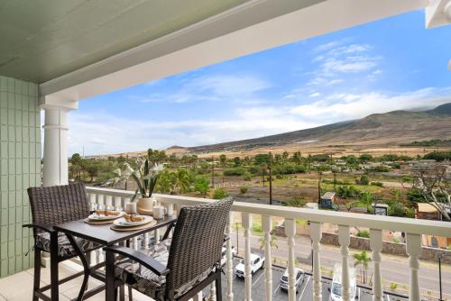 a balcony with a table and chairs with a view at Lahaina Shores 512 · LS 512 Getaway Studio by the Beach Pool Hot in Lahaina