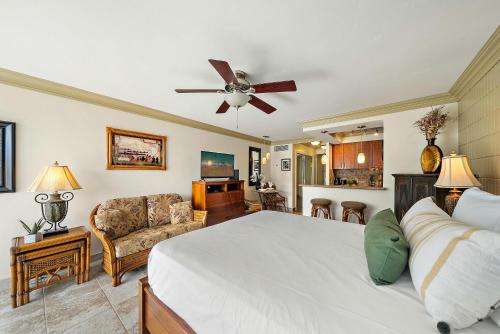 a bedroom with a bed and a living room at Lahaina Shores 512 · LS 512 Getaway Studio by the Beach Pool Hot in Lahaina
