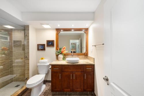 a bathroom with a toilet and a sink and a shower at Lahaina Shores 512 · LS 512 Getaway Studio by the Beach Pool Hot in Lahaina