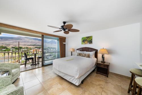a bedroom with a bed and a balcony at Lahaina Shores 418 · LS 418 Studio Near Beach, Pool & Relaxing H in Lahaina