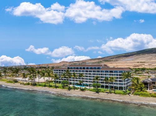 a hotel on the beach next to the water at Lahaina Shores 418 · LS 418 Studio Near Beach, Pool & Relaxing H in Lahaina