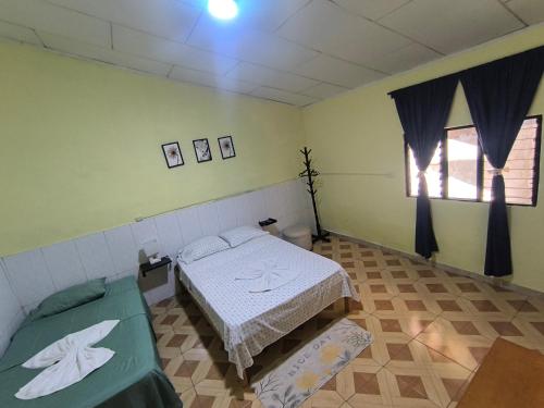 Ένα ή περισσότερα κρεβάτια σε δωμάτιο στο Acogedor Apartamento en Iquitos