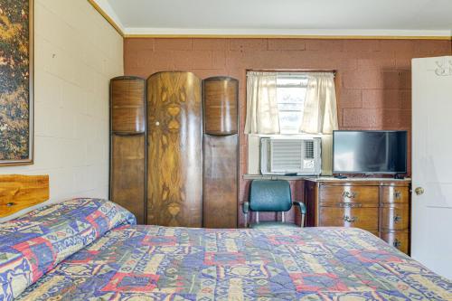a bedroom with a bed and a tv at Easy Lake and Hiking Trails Access Whitney Studio in Whitney
