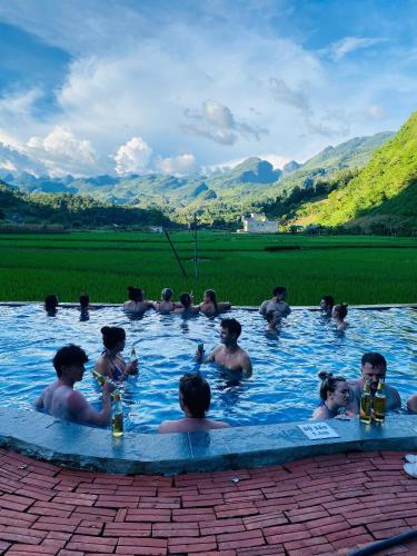 a group of people in a swimming pool at Homestay Tommy House in Ha Giang