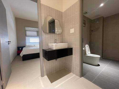 a bathroom with a sink and a toilet at SUNNY villa by the beach-Private Pool-3 bedrooms in Nha Trang