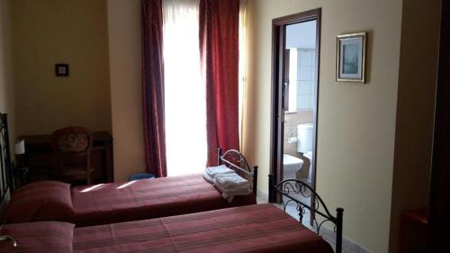 A bed or beds in a room at Il Nido Degli Angeli