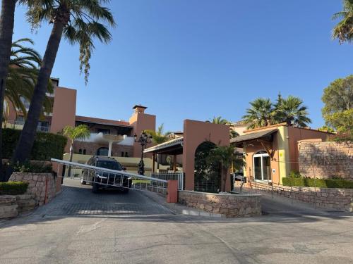a car parked in front of a house at FourSeasons Vilamoura in Quarteira