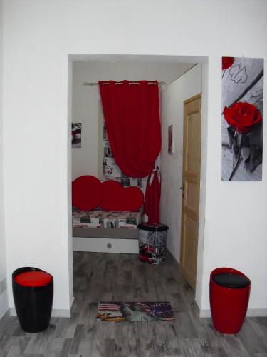 a room with a bed with a red curtain at APPARTAMENTO Exclusive in Marsala