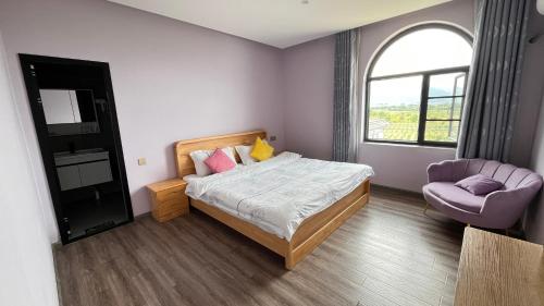 Postel nebo postele na pokoji v ubytování Dali Sifan Homestay