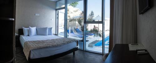 Postel nebo postele na pokoji v ubytování Boutique Hotel Portofino
