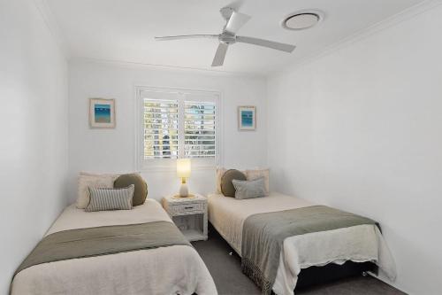 Katil atau katil-katil dalam bilik di Unit 33 of 8 James in the Outrigger Resort, Noosaville