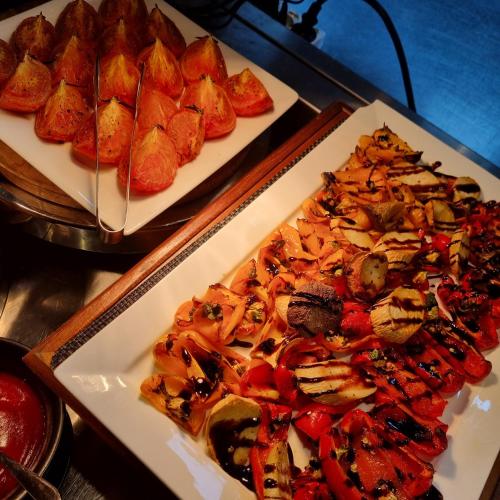 a table with two plates of food on it at Hotel ORA Incheon in Incheon