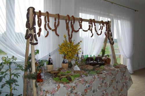a table filled with food and bottles of wine at Przystanek Czapla in Czaplinek